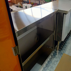 stainless steel worktable in the small food kiosk